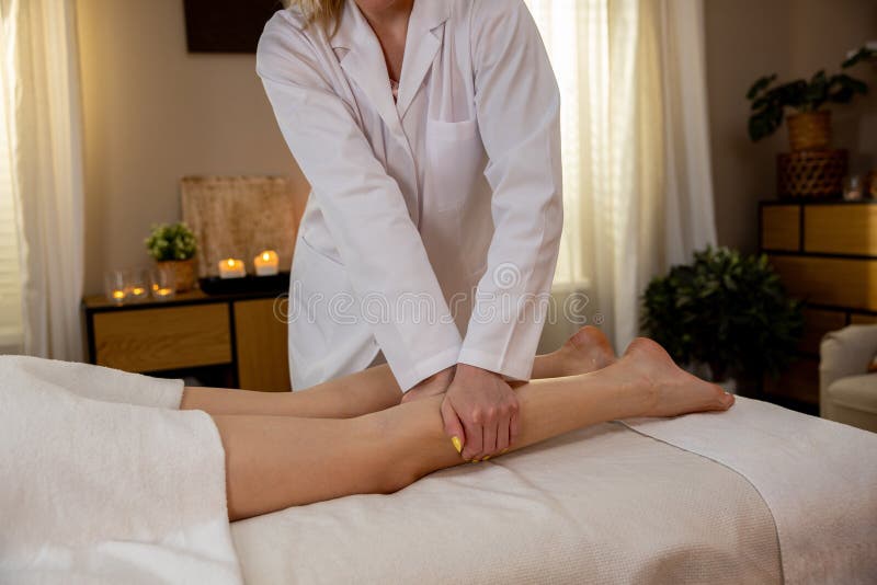 A soothing massage therapy session that promotes relaxation and wellness for true rejuvenation and relief. Pampering experience stock images, royalty-free photos and pictures
