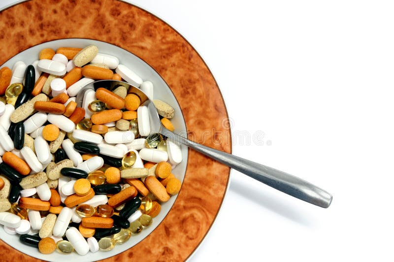 A view with some drugs and vitamins in a plate. A view with some drugs and vitamins in a plate