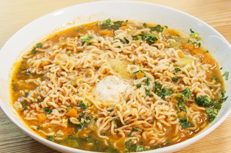 A plate with a delicious and spicy asiatic noodles soup. A plate with a delicious and spicy asiatic noodles soup