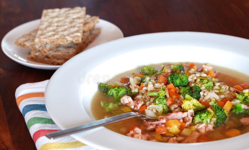 Rabbit soup with barley and vegetables with rye crisp bread. Rabbit soup with barley and vegetables with rye crisp bread