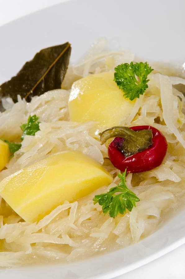 Sauerkraut soup with boiled potatoes on a plate. Sauerkraut soup with boiled potatoes on a plate