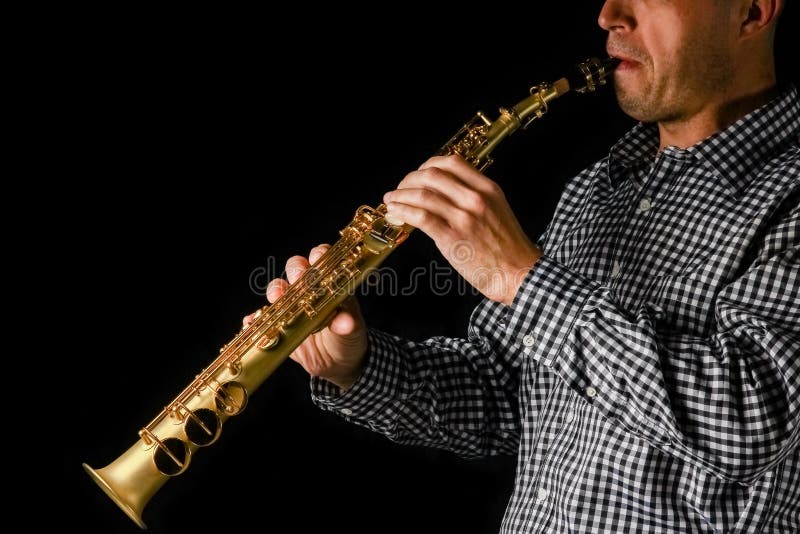 Soprano Saxophone in Hands on a Black Background Stock Image Image of