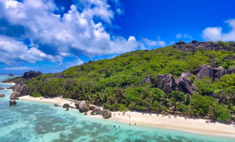 Anse Source Argent, La Digue. Amazing aerial view from drone on a beautiful sunny day - Seychelles Islands. Anse Source Argent, La Digue. Amazing aerial view from drone on a beautiful sunny day - Seychelles Islands