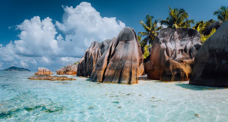 Anse Source d&#x27;Argent - Dreamlike, paradise beach with unique bizarre granite boulders, shallow lagoon. La Digue island, Seychelles. Anse Source d&#x27;Argent - Dreamlike, paradise beach with unique bizarre granite boulders, shallow lagoon. La Digue island, Seychelles.