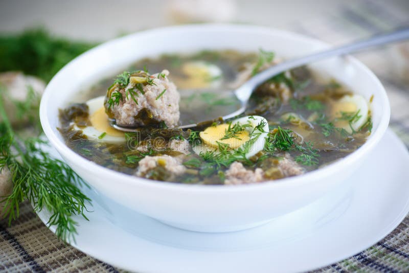 Sorrel soup with meatballs and eggs