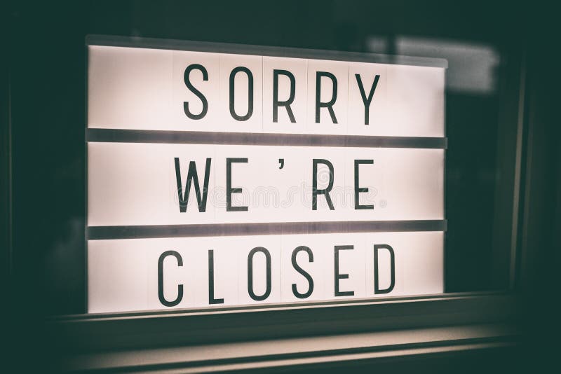 SORRY WE`RE CLOSED storefront window sign. Coronavirus Closure due to COVID-19 message board in business retail store