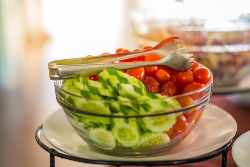 Sorted Fresh Salads Displayed on a Buffet in Restaurant Stock Photo
