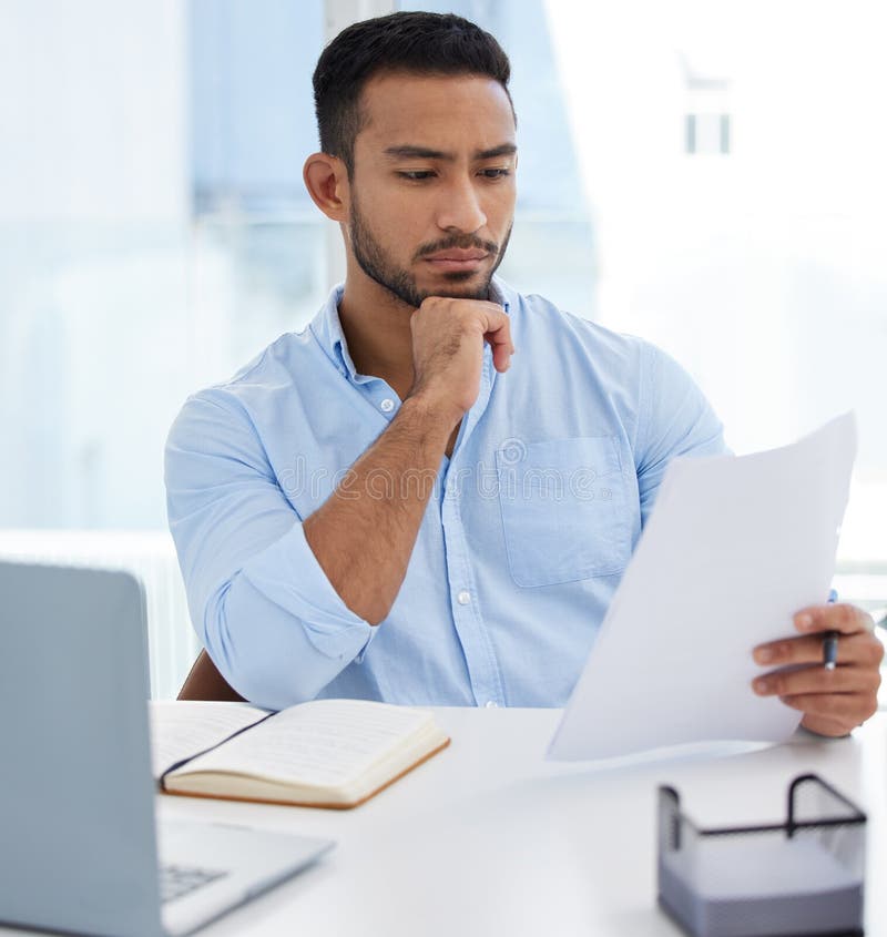 Sorting Business Matters. a Young Businessman Going through Paperwork