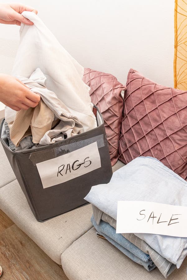 Sorting old clothes for sale, donations and rags, the concept of conscious consumption. Charity sorting stock images, royalty-free photos and pictures