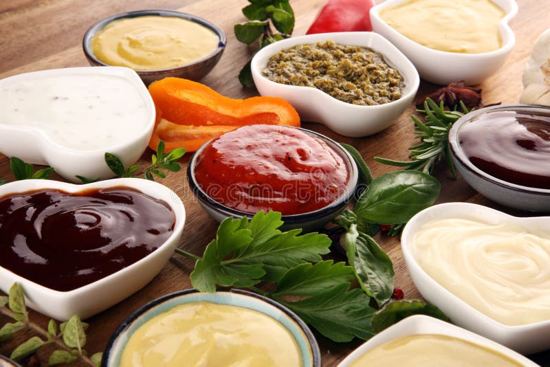 Sauces Assortment. Set of various sauces in bowls with ketchup, mayonnaise, pesto and mustard. Sauces Assortment. Set of various sauces in bowls with ketchup, mayonnaise, pesto and mustard