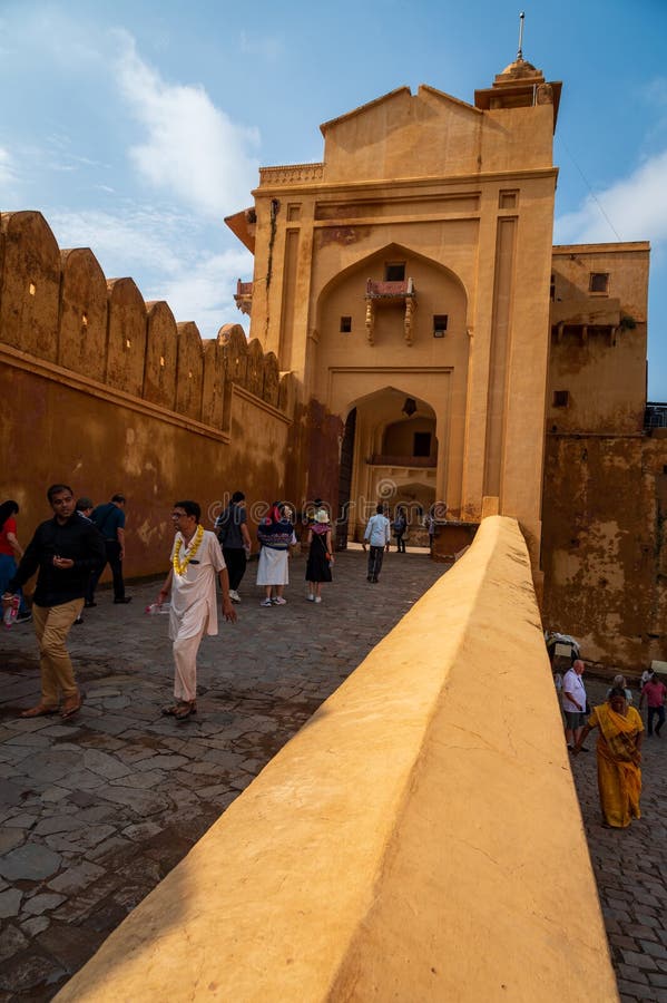 Suraj Pol (Sun Gate) of the Amber, Fort Amer , Rajasthan, India. A narrow 4WD road leads up to the entrance gate, known as the Suraj Pol (Sun Gate) of the fort. It is now considered much more ethical for tourists to take jeep rides up to the fort, instead of riding the elephants. Amer Fort or Amber Fort is a fort located in Amer, Rajasthan, India. Amer is a town with an area of 4 square kilometres (1.5 sq mi) located 11 kilometres (6.8 mi) from Jaipur, the capital of Rajasthan. Located high on a hill, it is the principal tourist attraction in Jaipur. Amer Fort is known for its artistic style elements. With its large ramparts and series of gates and cobbled paths, the fort overlooks Maota Lake which is the main source of water for the Amer Palace. Suraj Pol (Sun Gate) of the Amber, Fort Amer , Rajasthan, India. A narrow 4WD road leads up to the entrance gate, known as the Suraj Pol (Sun Gate) of the fort. It is now considered much more ethical for tourists to take jeep rides up to the fort, instead of riding the elephants. Amer Fort or Amber Fort is a fort located in Amer, Rajasthan, India. Amer is a town with an area of 4 square kilometres (1.5 sq mi) located 11 kilometres (6.8 mi) from Jaipur, the capital of Rajasthan. Located high on a hill, it is the principal tourist attraction in Jaipur. Amer Fort is known for its artistic style elements. With its large ramparts and series of gates and cobbled paths, the fort overlooks Maota Lake which is the main source of water for the Amer Palace.