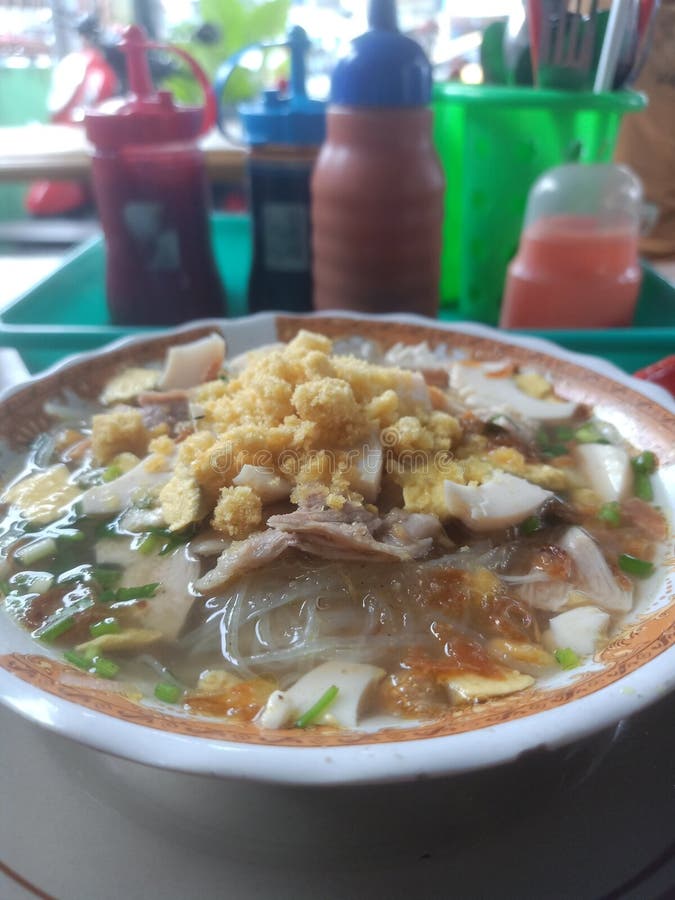 Soto Ayam Lamongan - Lamongan chicken soup with a yellowish sauce. Soto Ayam Lamongan - Lamongan chicken soup with a yellowish sauce