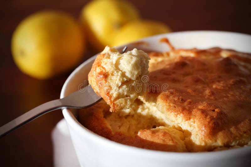 Soufflé with cheese on a fork, eating