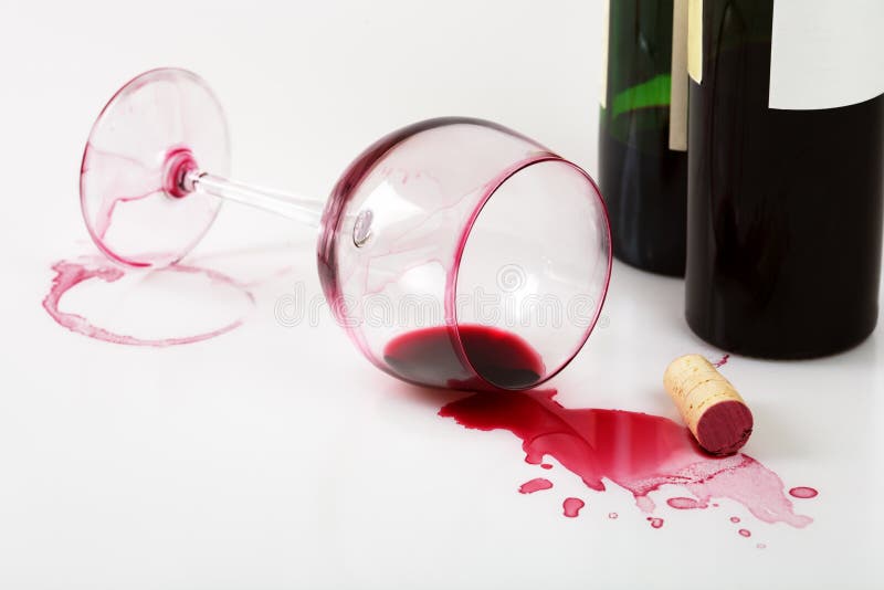 Souillures retournées en verre et de vin photographie stock Souillures retournées en verre et de vin photographie stock