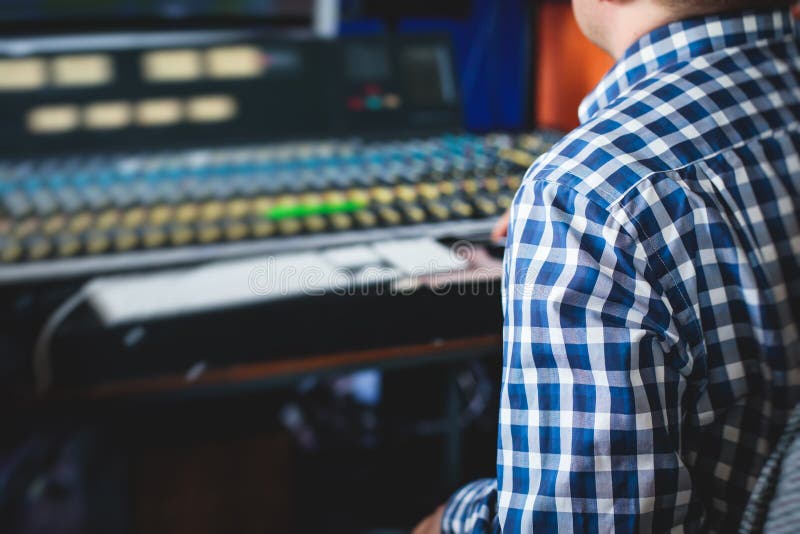 Sound Editor Engineer Working at Studio with Mixing Panel, Mixing Music