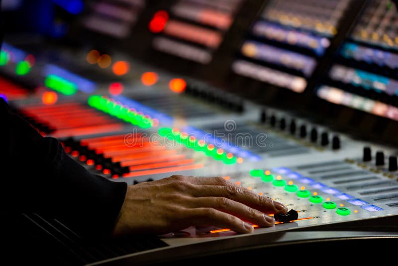 Sound engineer controls the settings of mixing console royalty free stock images