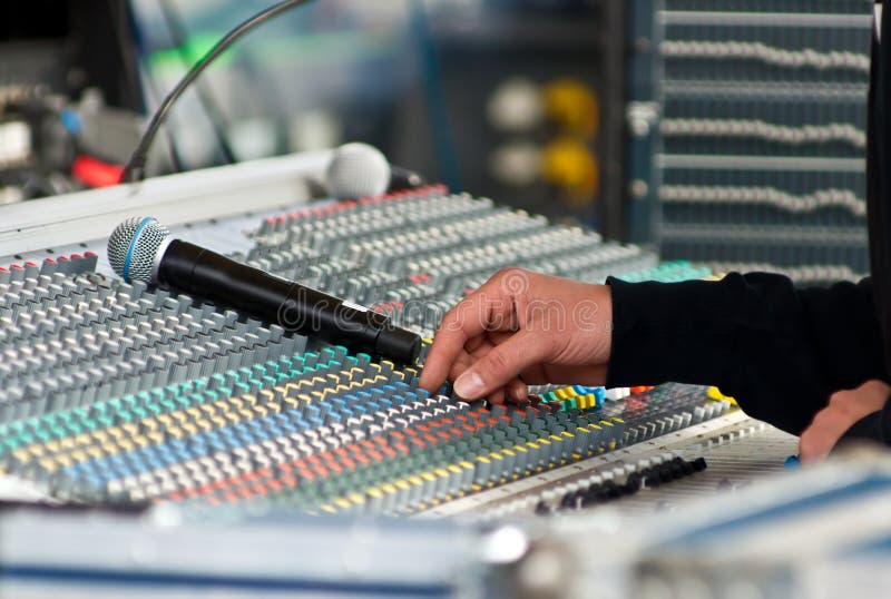 Sound engineer at mixing desk royalty free stock images