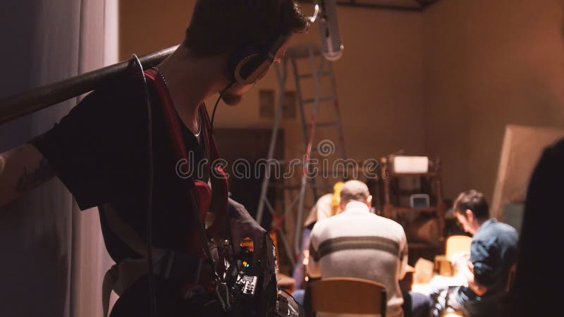 Sound engineer working on the independent cinema production - film set royalty free stock photos Sound engineer working on the independent cinema production - film set royalty free stock photos