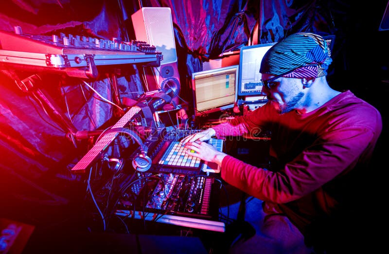 Sound engineer working at mixing panel in the in sound recording studio. stock photos