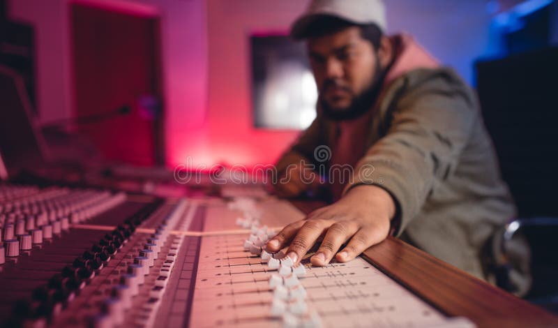 Sound engineer working on music mixer royalty free stock photos