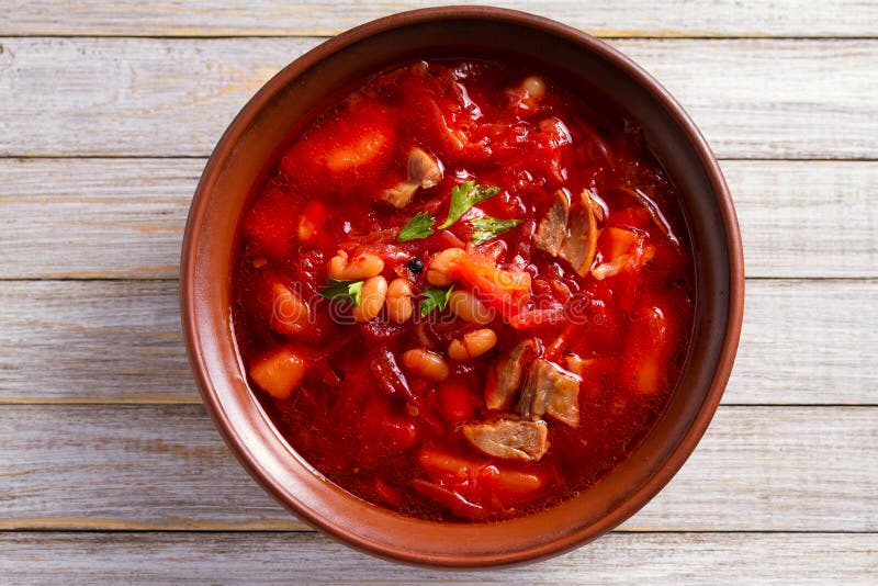 Soup made with vegetables, meat, bean and beet root: borsht, bortsch, borshch, borscht