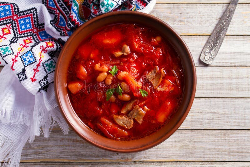 Soup made with vegetables, meat, bean and beet root: borsht, bortsch, borshch, borscht