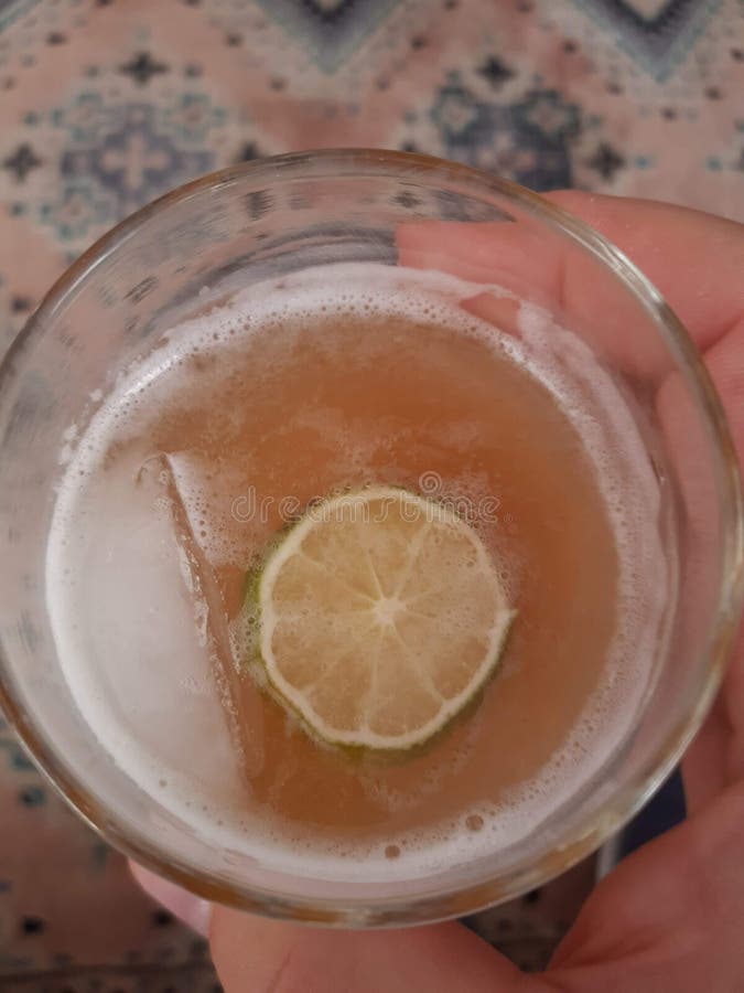Sour Alcoholic Beverage Drink in a Glass with Ice and Lime Stock Photo Image of glass