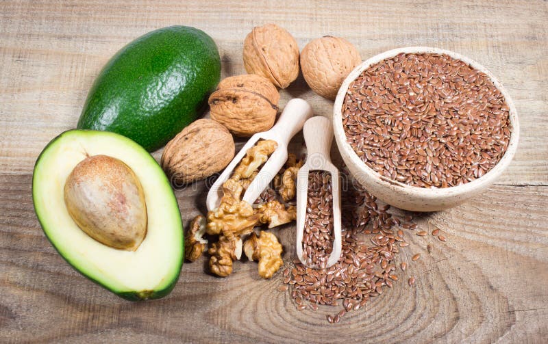 Sources of Omega 3 Fatty Acids Flaxseeds, Avocado and Walnuts Stock
