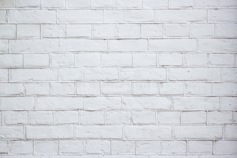 Soustrayez le vieux stuc souillé par texture superficiel par les agents gris-clair et avez vieilli le fond blanc de mur de brique