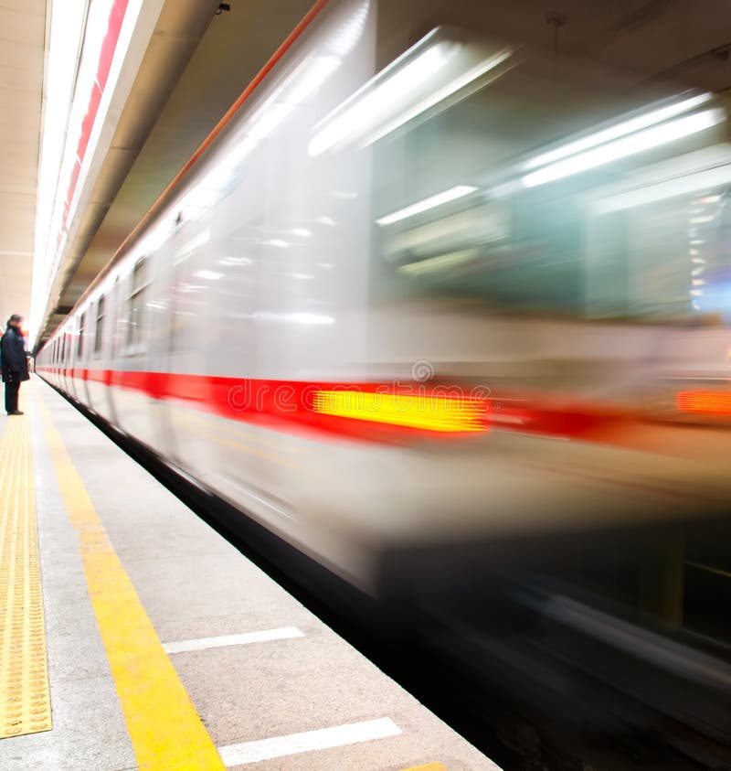 A subway train passing by and capture with a motion blur swing in China. A subway train passing by and capture with a motion blur swing in China.