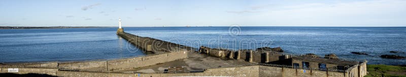 South breakwater lighthouse and a barbed wire brick wall preventing entrance to public, Aberdeen, Scotland royalty free stock image South breakwater lighthouse and a barbed wire brick wall preventing entrance to public, Aberdeen, Scotland royalty free stock image