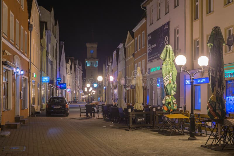 Warszawska Street in the city of Zagan at night.
