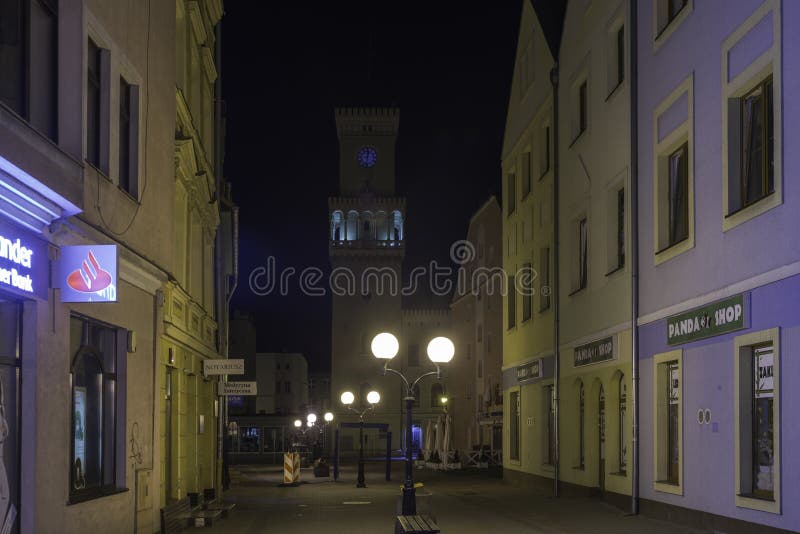 Warszawska Street in the city of Zagan at night.