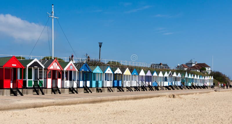 SOUTHWOLD, SUFFOLK/UK - JUNE 2 : Colourful Beach huts in Southwold Suffolk on June 2, 2010. Unidentified people. SOUTHWOLD, SUFFOLK/UK - JUNE 2 : Colourful Beach huts in Southwold Suffolk on June 2, 2010. Unidentified people.