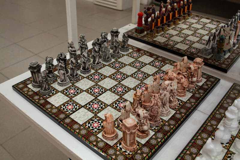 brown chess board with figures on a wooden table in a cafe, playing chess  Stock Photo - Alamy