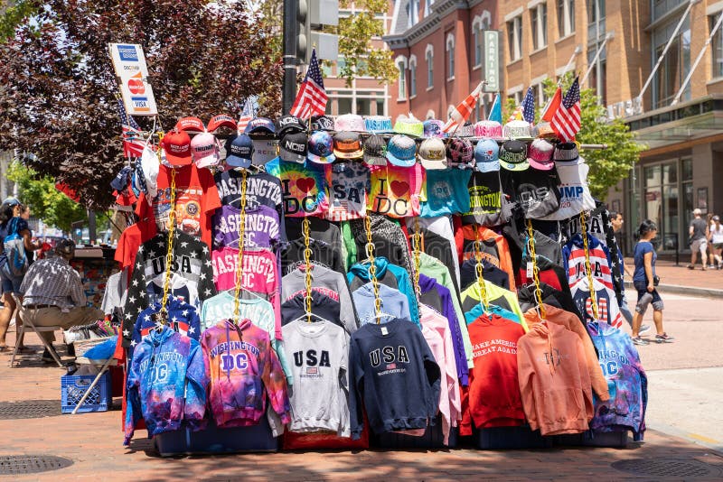 Washington, DC - August 4, 2019: A souvenir stand on the sidewalk of Penn Quarter selling Washington DC themed shirts and hats to tourists