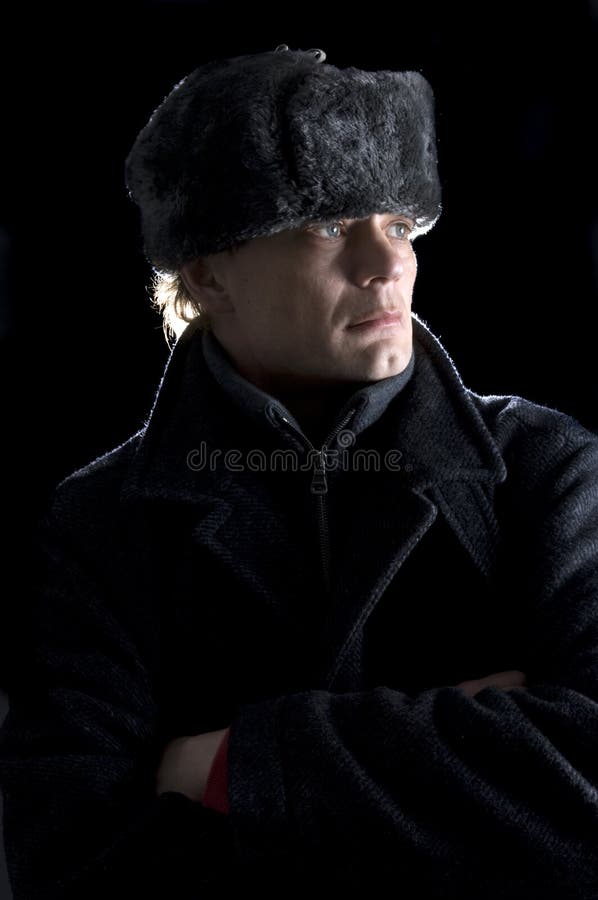 A man, dressed in Soviet attire looking away from the camera. Old communist block stock images, royalty-free photos and pictures