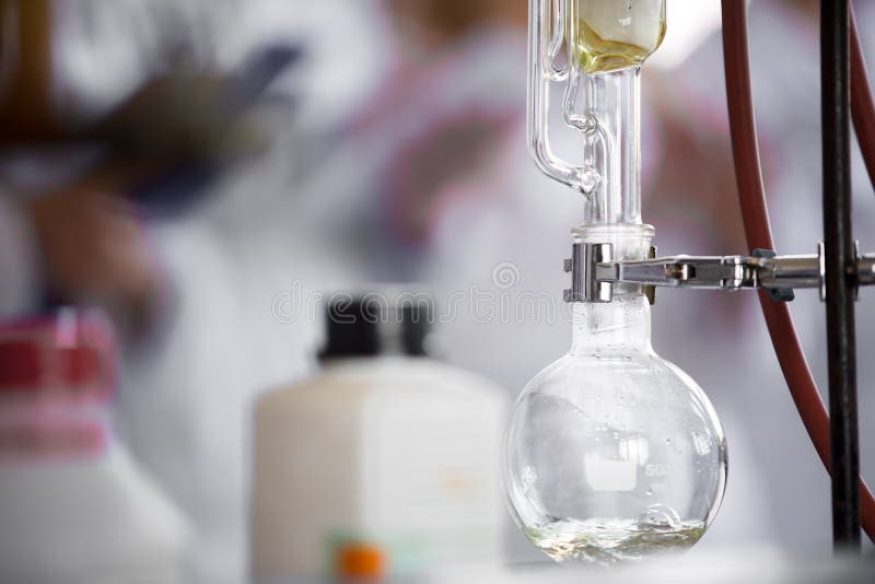 Soxhlet extractor for extraction essential oils.Transporting liquid from soxhlet extractor to distillation apparatus.Demonstration royalty free stock photo
