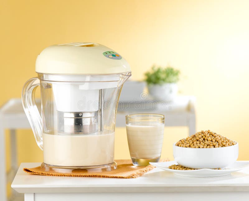 Soybean milk maker machine in the kitchen. Soy milk maker machine easy and convenience an images isolated in the kitchen interior stock images