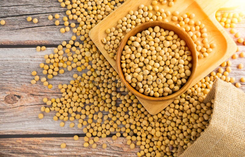 Soybeans in Brown Wooden Bowl with Soybeans Pour from Bag Stock Image ...