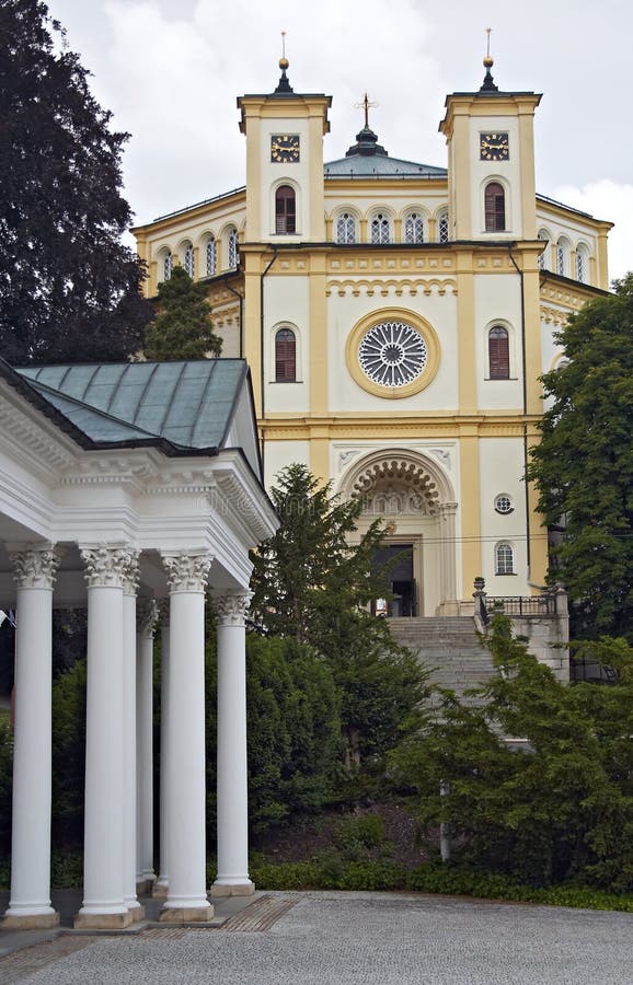 Colonnade and the church, spa Marianske Lazne. Pillar column garden stock images, royalty-free photos and pictures
