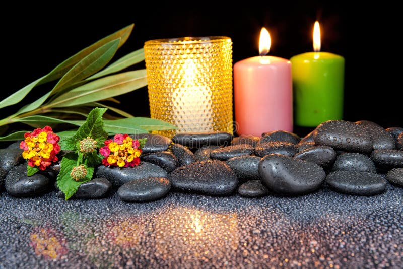 Spa Decoration with Stones and Candles on a Black Background Stock