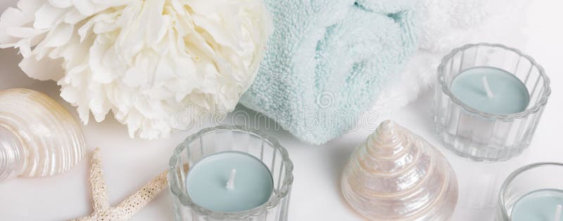 Spa gentle spring or summer background banner with peony flowers and seashells, candles