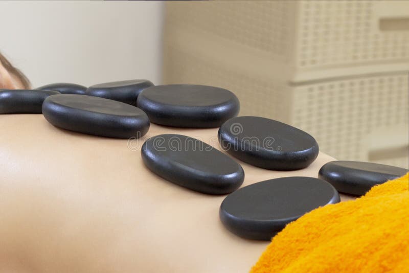 Spa Hot Stone Massage Stone Treatment Woman Getting A Hot Stone Massage At A Day Spa Stock