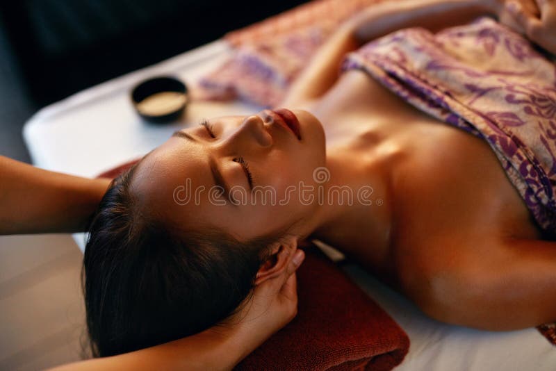 Spa Massage. Hands Massaging Woman Head At Thai Beauty Salon