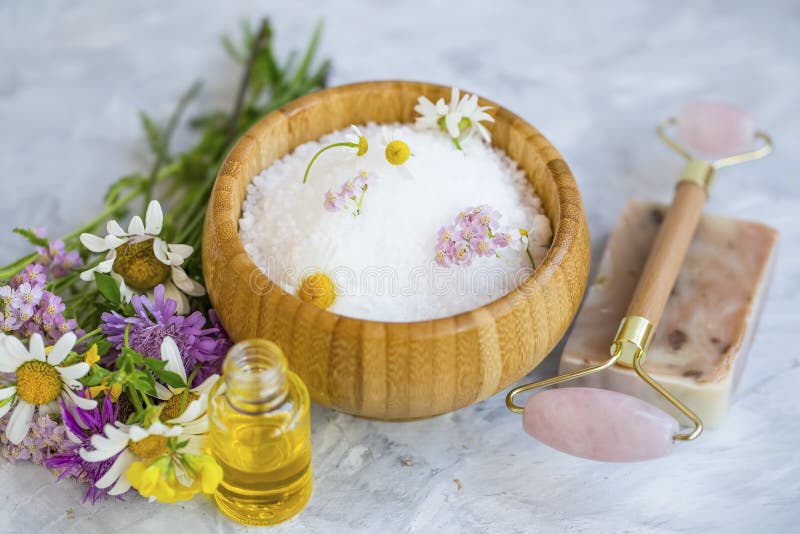 Spa still life bath salt with essential oils and medicinal healing herbs , flowers and plants. Spa still life bath salt with essential oils and medicinal healing herbs , flowers and plants