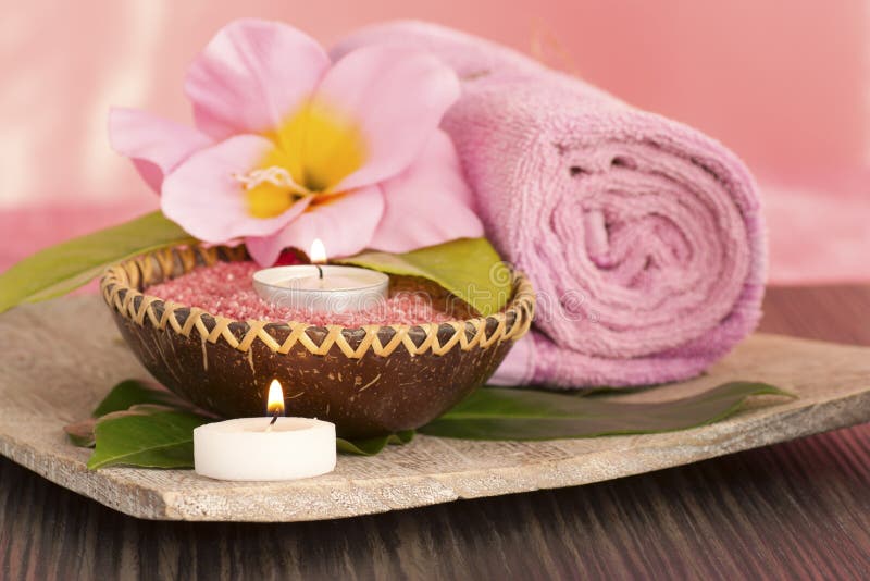 Massage Composition Spa with Candles, Orchids and Black Stones in