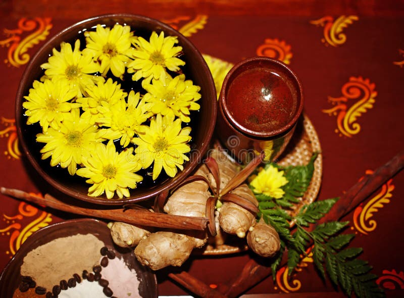 Spa still life with flower on brown background.