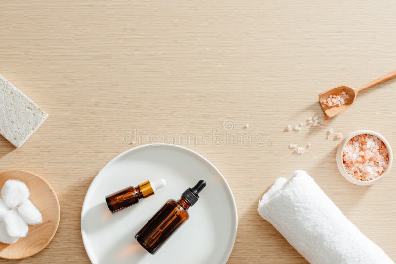 Spa still life top view with flowers, natural oil, bath salt and towels, spa skincare products, pumice stone royalty free stock images Spa still life top view with flowers, natural oil, bath salt and towels, spa skincare products, pumice stone royalty free stock images