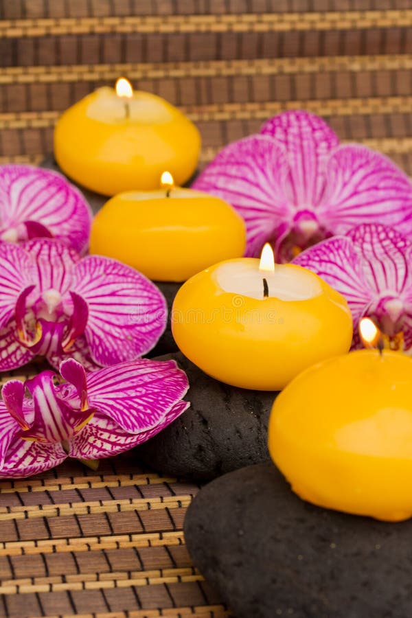 Candles and orchids. stock image. Image of resort, serene 3181475